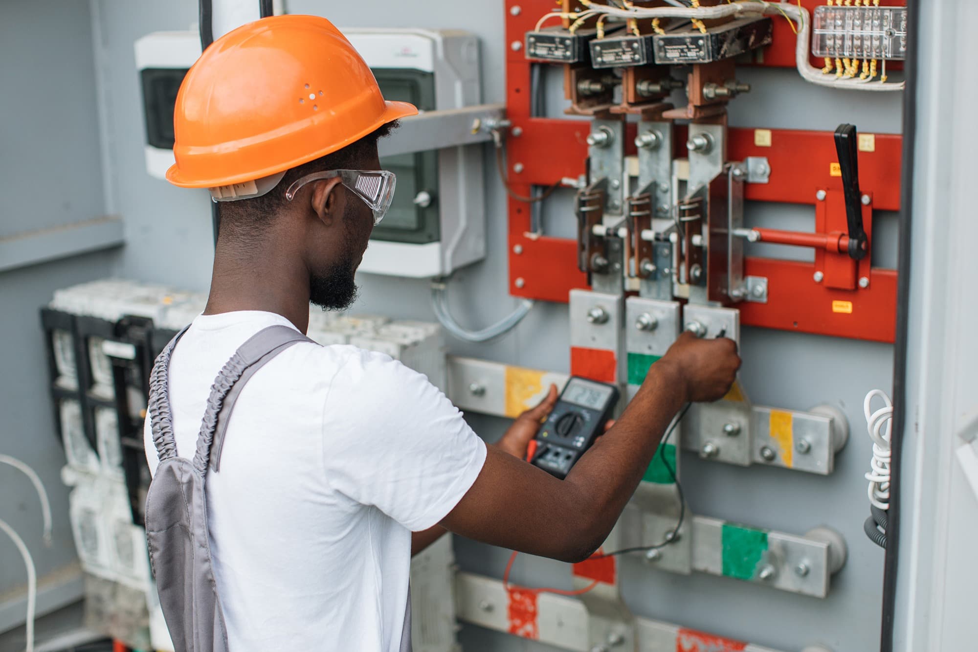 Primal technician working on electrical panel